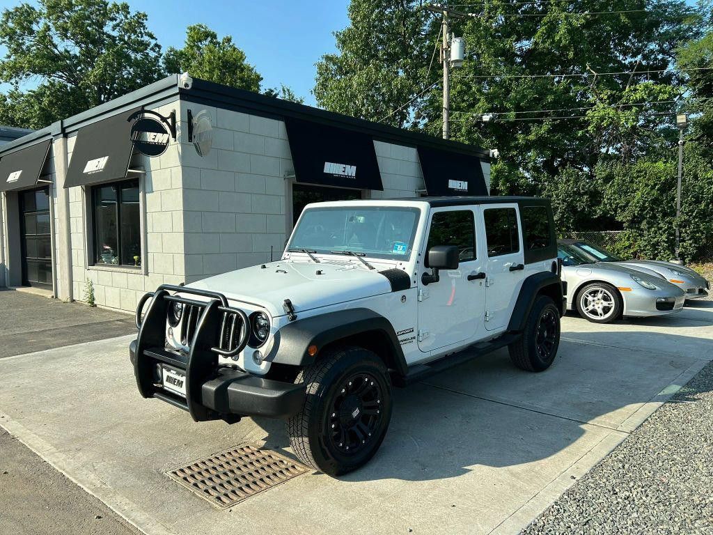 2017 JEEP Wrangler Unlimited Sport for sale at EM Motorcars